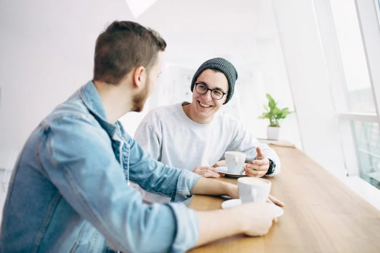 An adult and a young person have a productive conversation.