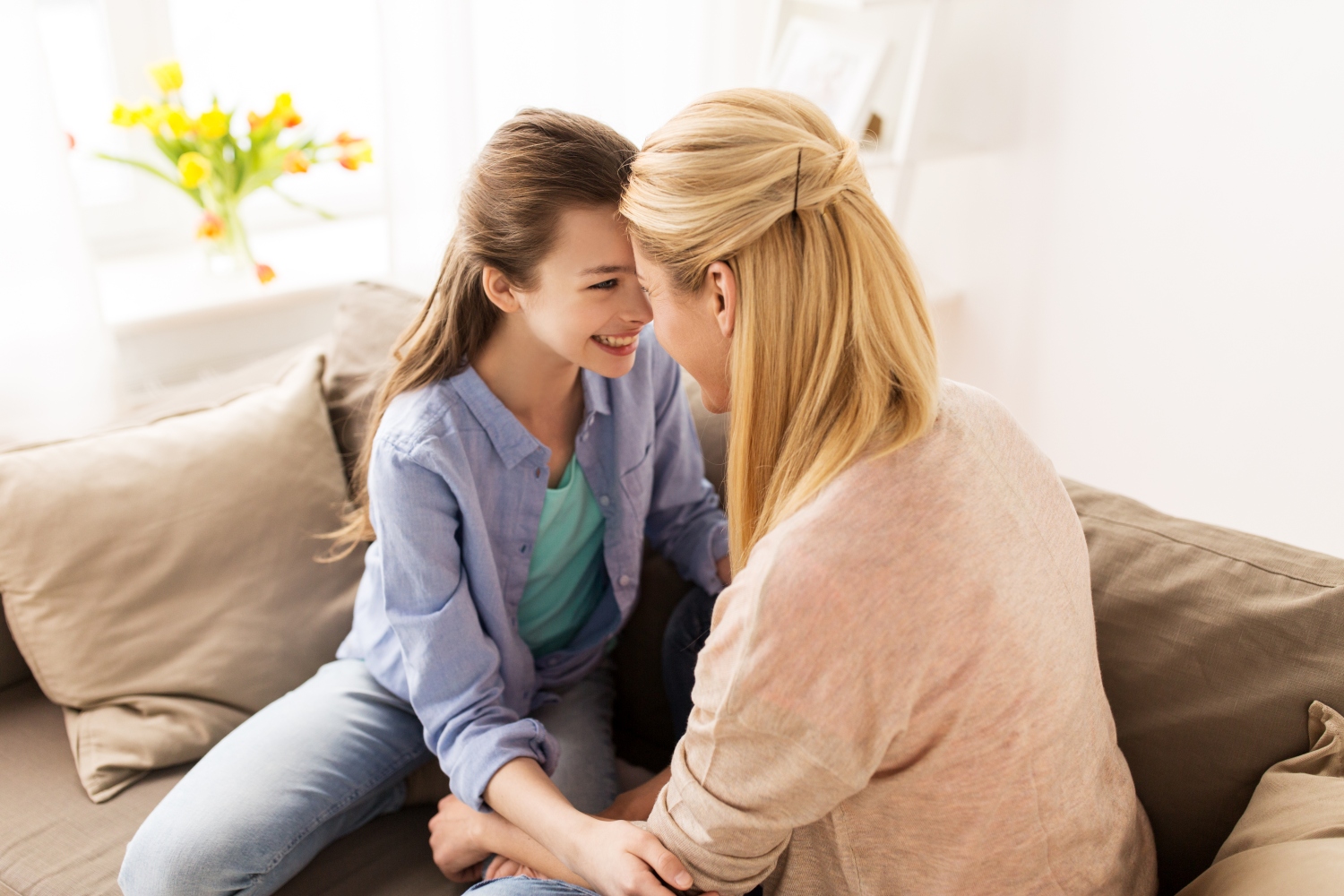 happy smiling family of girl and mother at home, concept of teenage mental health