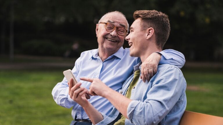 grandfather talking to grandson or son, concept of parenting