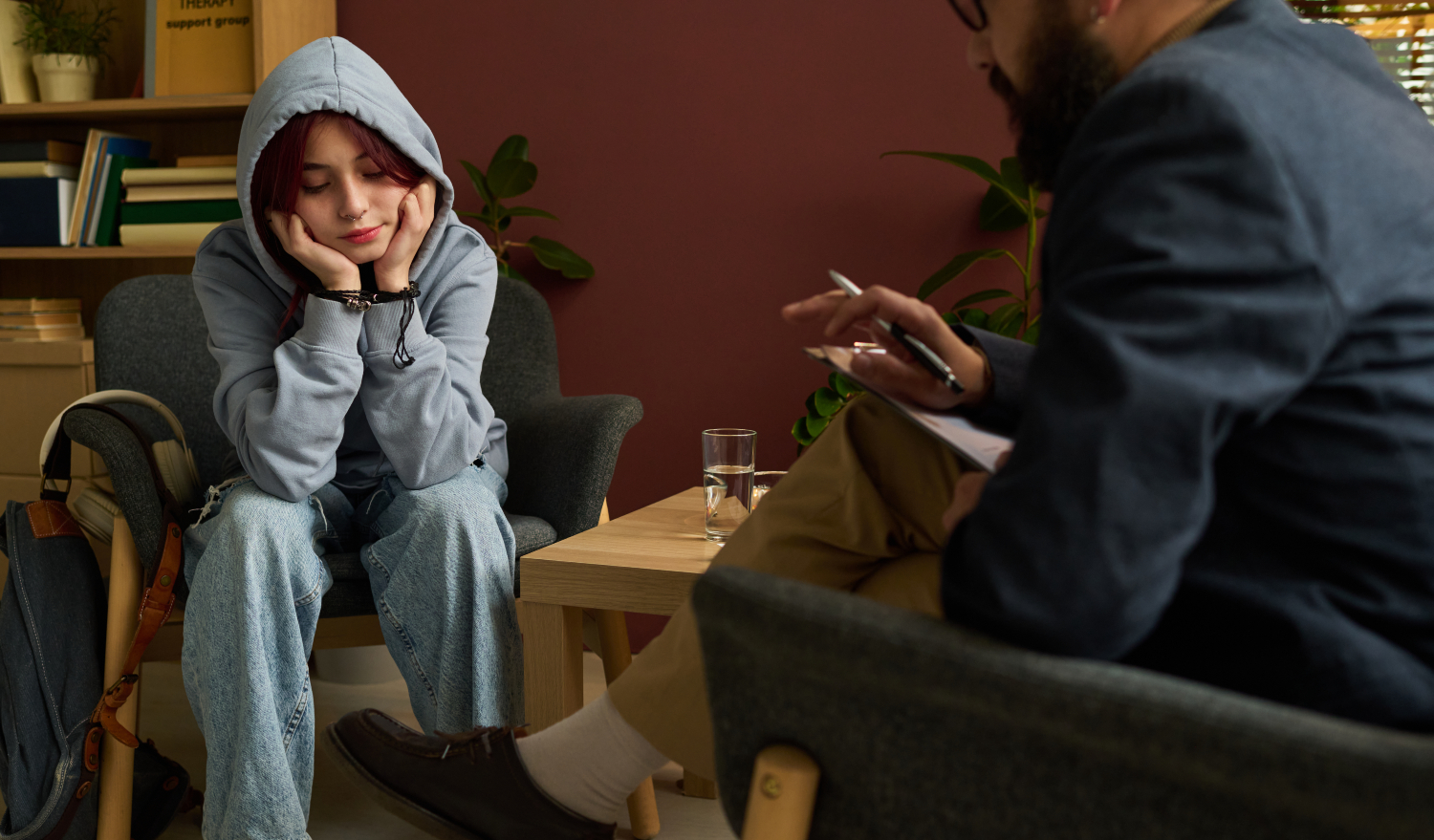 Girl sharing concerns and issues with psychologist, concept of consultation and therapy