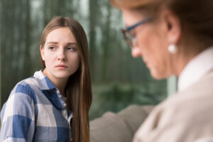 Thoughtful, Sad Teenager Sitting At Psychologist'S Office