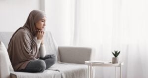 teenage girl looking depressed while sitting at home, concept of mental health