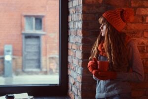 girl in a decorated living room at Christmas time