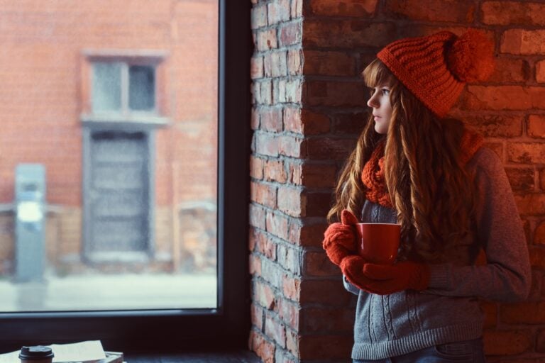 girl in a decorated living room at Christmas time