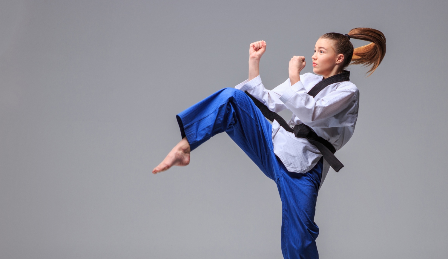 teenage girl training in martial arts
