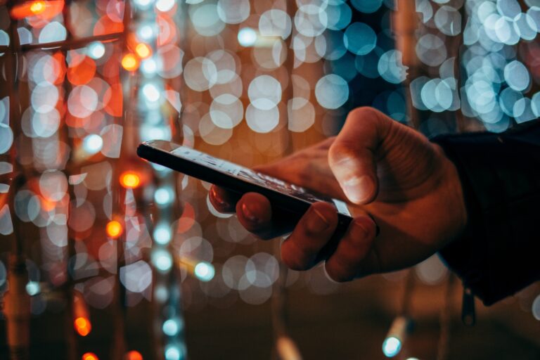 Hand Holding and Using a Phone at Night